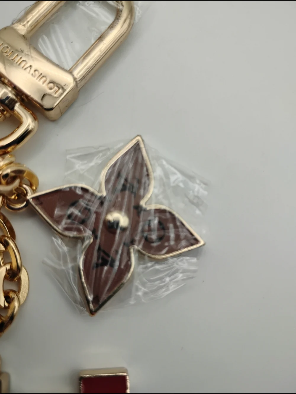 Louis Vuitton Red & Gold-Tone Keychain Charm With Pink and Brown Accents BNWOT